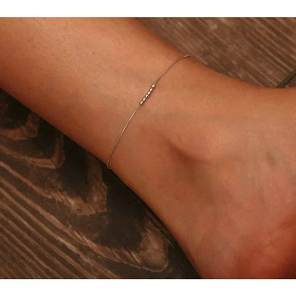 La délicate chaîne de cheville en argent sterling 925 avec perles