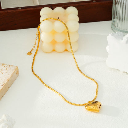 ABEL : Chaîne en câble ouvragée avec pendentif Cœur gonflé en or.