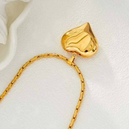ABEL : Chaîne en câble ouvragée avec pendentif Cœur gonflé en or.