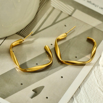 Boucles d'oreilles créoles sculpturales ADAMMA
