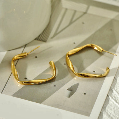 Boucles d'oreilles créoles sculpturales ADAMMA