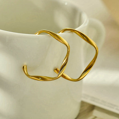 Boucles d'oreilles créoles sculpturales ADAMMA