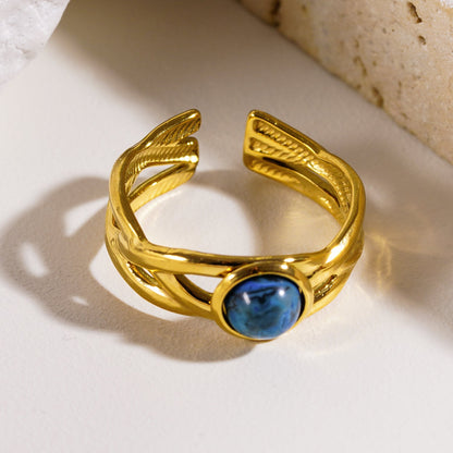 CHESA : Bague empilable torsadée avec pierre naturelle centrale.