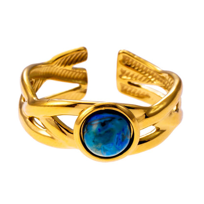 CHESA : Bague empilable torsadée avec pierre naturelle centrale.
