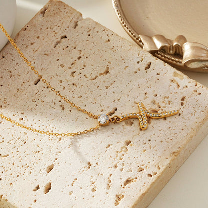 CRISTO Gold: Dainty Chain Necklace with a Zirconia Embedded Abstract Textured Cross Pendent
