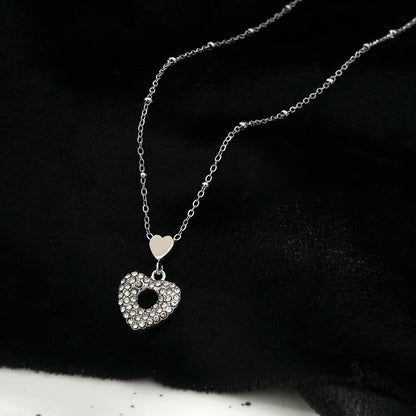 ETERNAL : Collier pendentif double cœur serti de zircones pavées