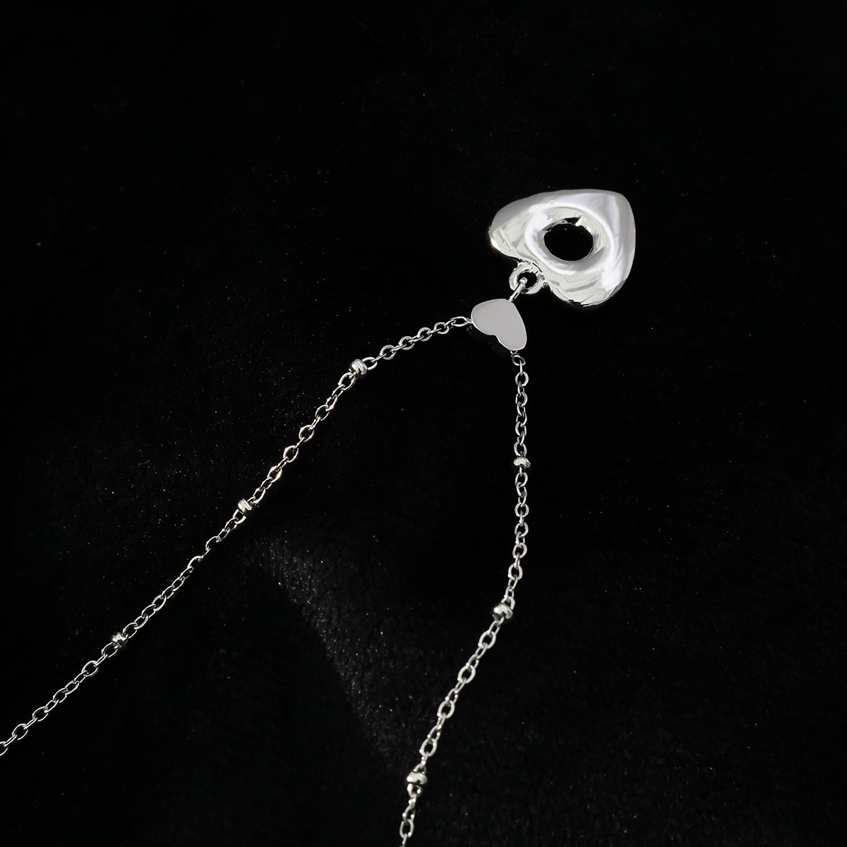 ETERNAL : Collier pendentif double cœur serti de zircones pavées