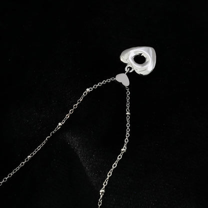 ETERNAL : Collier pendentif double cœur serti de zircones pavées