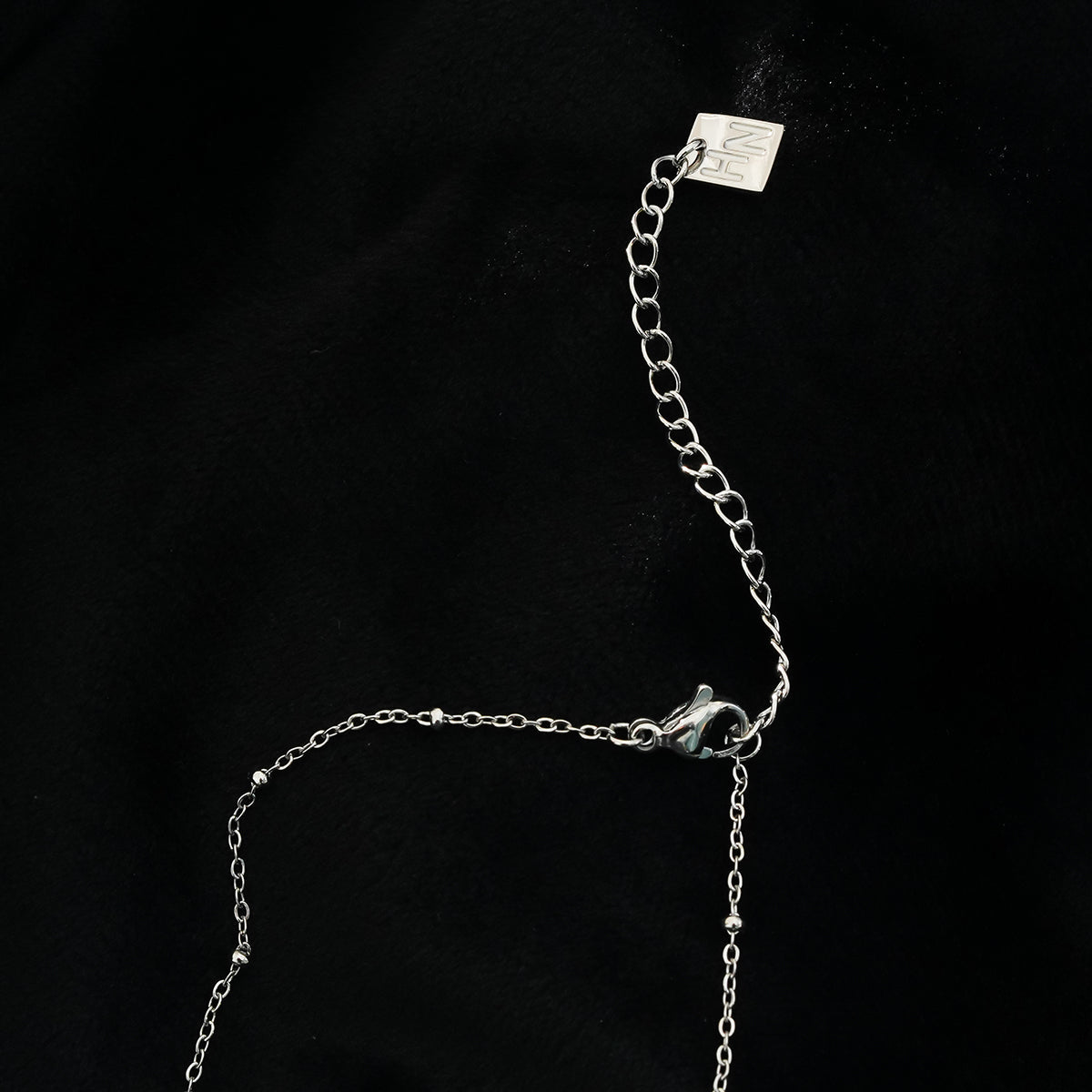 ETERNAL : Collier pendentif double cœur serti de zircones pavées