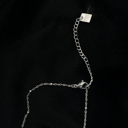 ETERNAL : Collier pendentif double cœur serti de zircones pavées