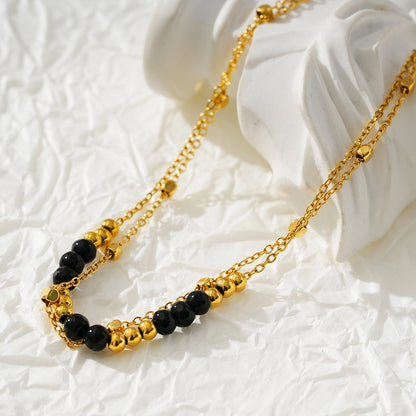 HILDA LG : Bracelet de cheville perles carrées et perles rondes deux-en-un noir et or.