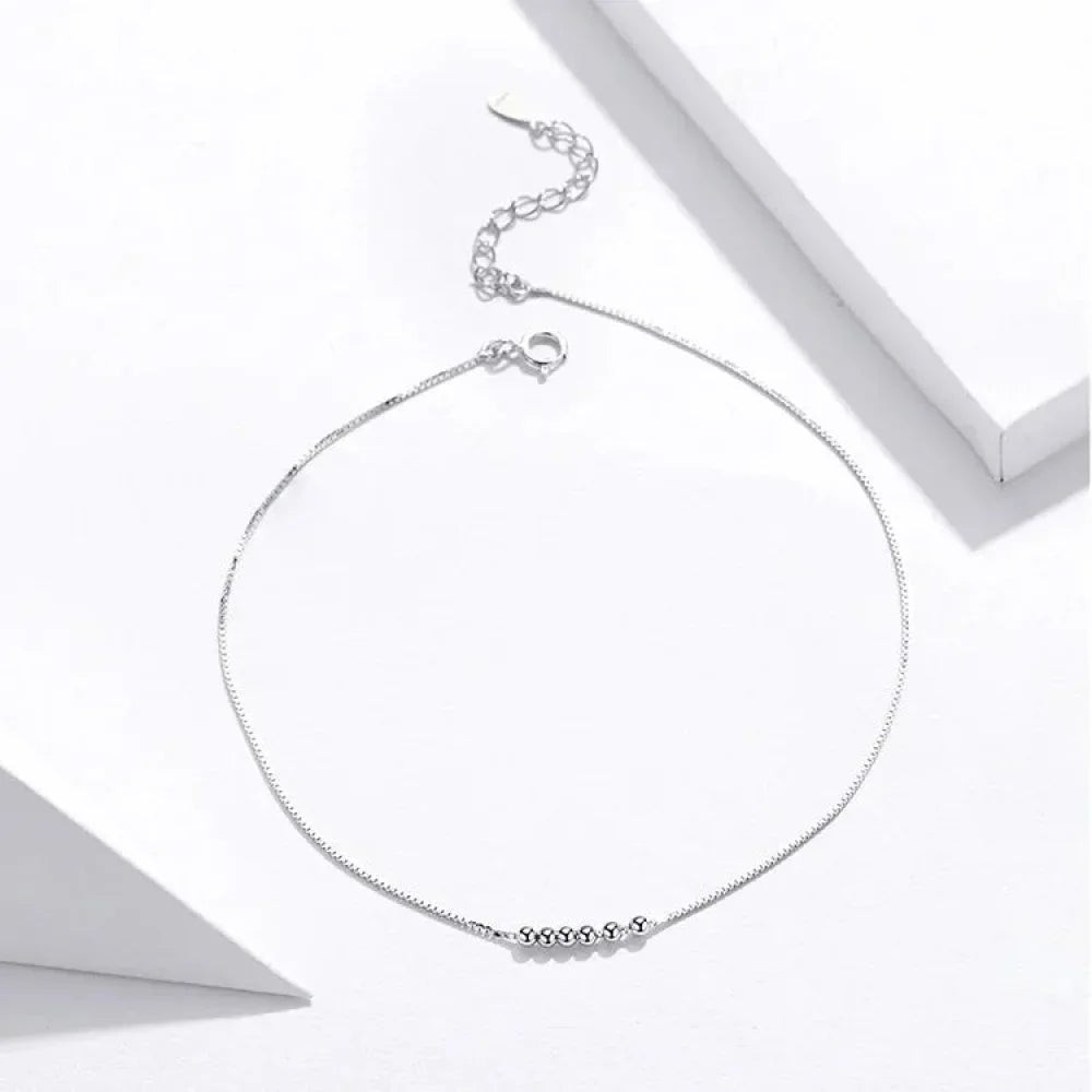 La délicate chaîne de cheville en argent sterling 925 avec perles