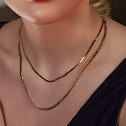 GINTA : Collier doré à 2 niveaux texturé peau de serpent