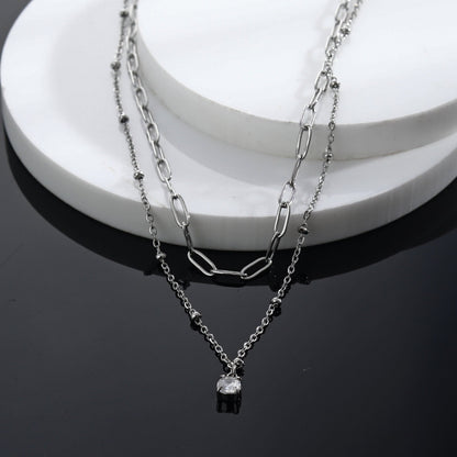 KATERI Argent : Collier chaînes superposées avec pendentif breloque solitaire zircone
