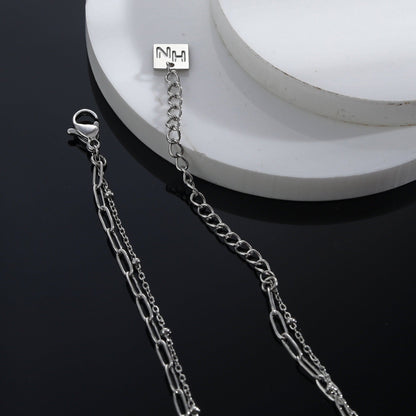 KATERI Argent : Collier chaînes superposées avec pendentif breloque solitaire zircone