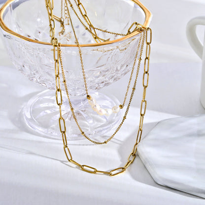 Collier MARLI multichaînes 3 rangs en or avec perles naturelles