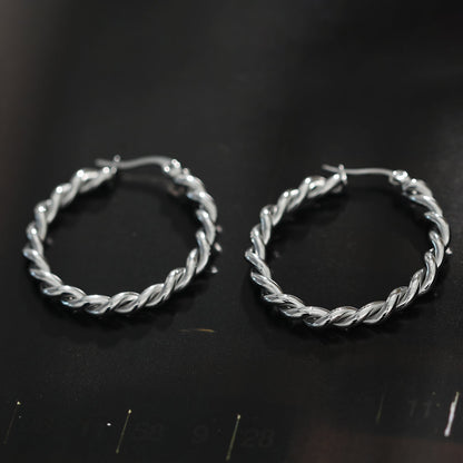 Boucles d'oreilles créoles torsadées SUKI en argent