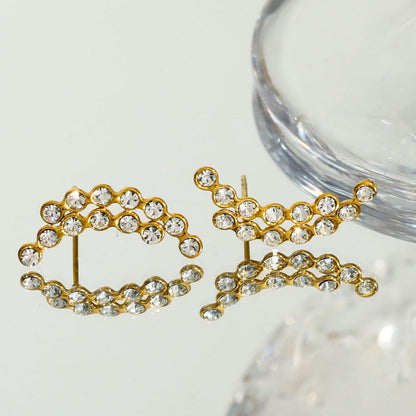 Boucles d'oreilles clous KIANI Duo Courbes Silhouettes en Zirconium