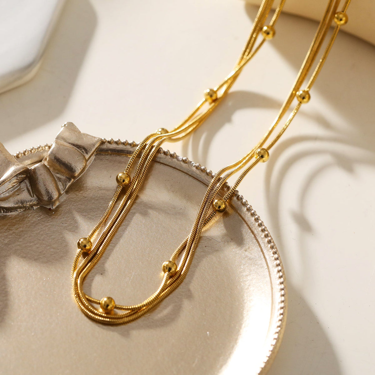 KAKIA: Triple Snake-Skin Chain Layered Necklace with Ball-Bead Accents