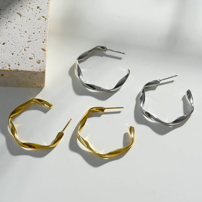 Boucles d'oreilles créoles sculpturales ADAMMA