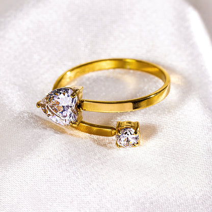RIZALINA: Classic Band Ring Anchoring Heart Shaped & Rounded Zirconia Gemstones