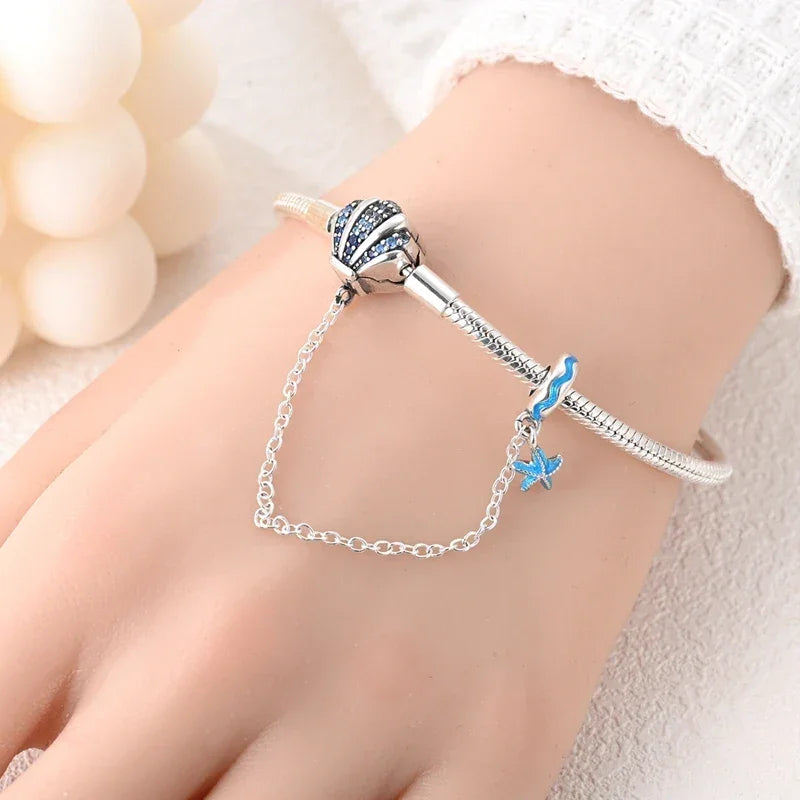 Bracelet breloque coquillage en argent sterling avec dégradé de zircones cubiques bleues