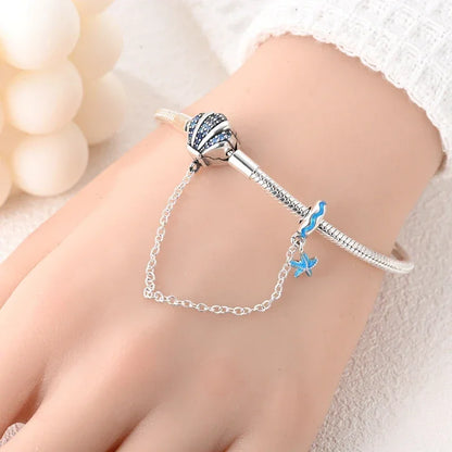 Bracelet breloque coquillage en argent sterling avec dégradé de zircones cubiques bleues