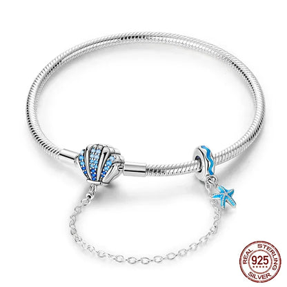 Bracelet breloque coquillage en argent sterling avec dégradé de zircones cubiques bleues