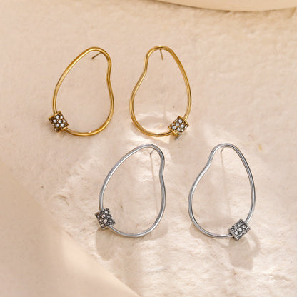Boucles d'oreilles créoles irrégulières SIMAN avec pavé de zircones en or