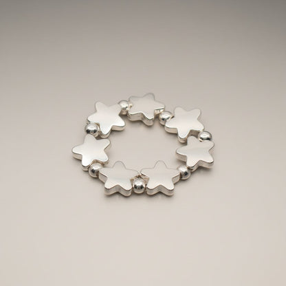 Elasticated Star Ring In Silver Plate