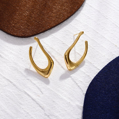 Boucles d'oreilles créoles TARAJI forme abstraite dorées