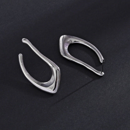 Boucles d'oreilles créoles forme abstraite TARAJI en argent