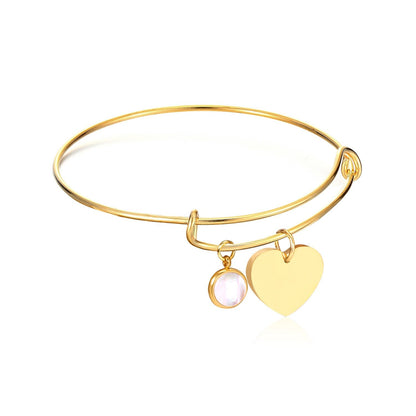 Bracelet jonc avec pendentif cœur en coquillage